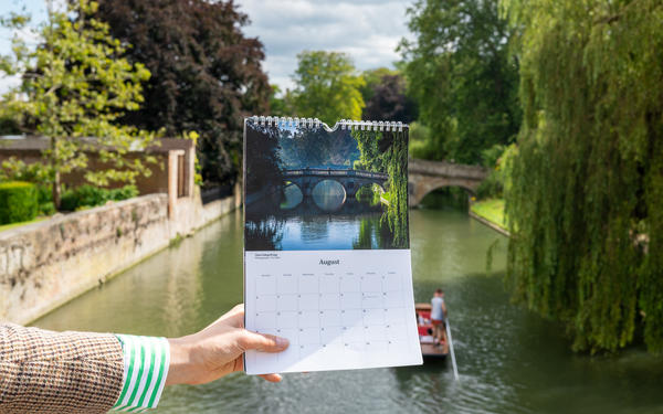 August page of the 2025 calendar on the foreground of the River Cam