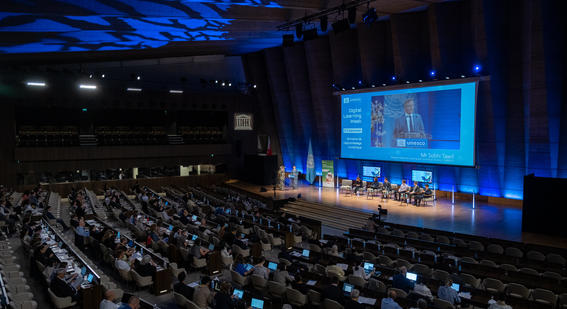 Stage and rows of people at the UNESCO Digital Learning Week 2024 event